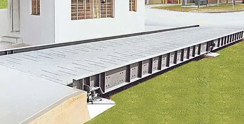 Pitless weighbridge platform on its side-support beams, with load cell mounts reachable above ground
